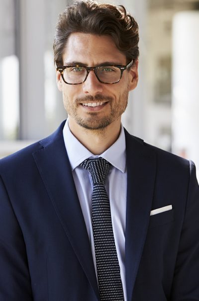 Portrait of young professional man in suit